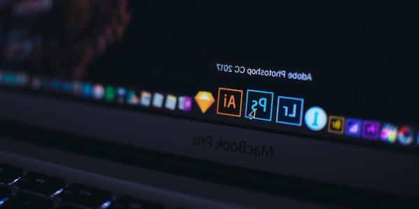 laptop with adobe creative cloud apps